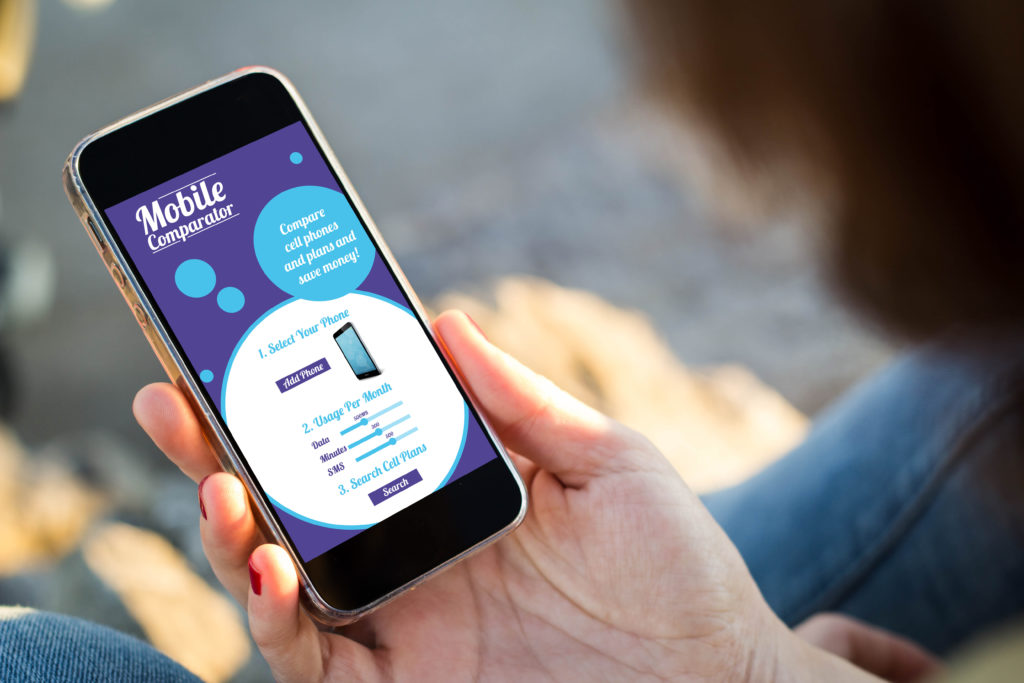 woman sitting in the street holding her smartphone with mobile r