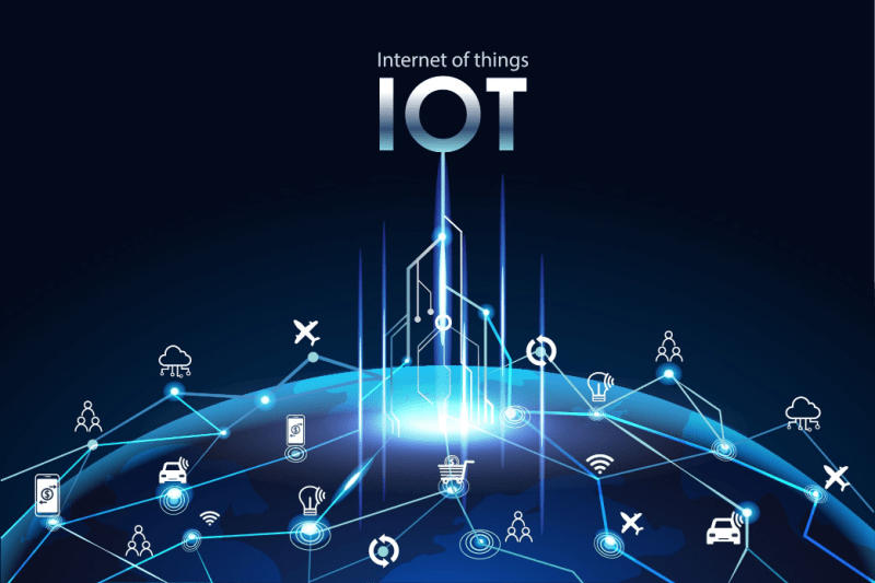 Techy graphic with the earth glowing blue on a black background and IOT hovering above it with white lines reaching down to earth creating a map of links